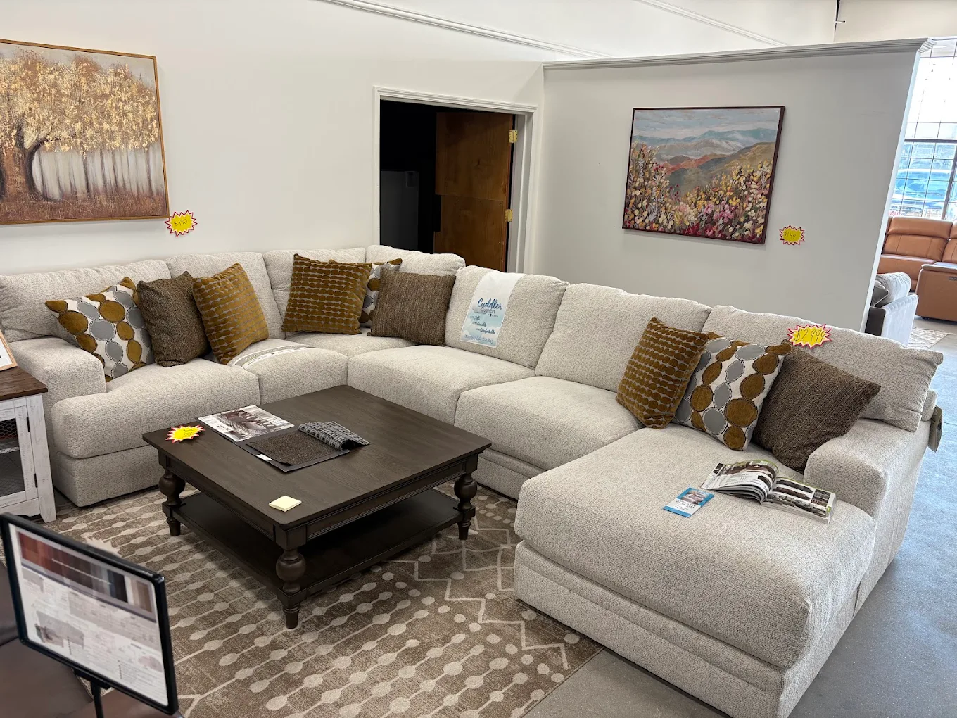 Cream sectional sofa with pillows in the Gateway Furniture showroom