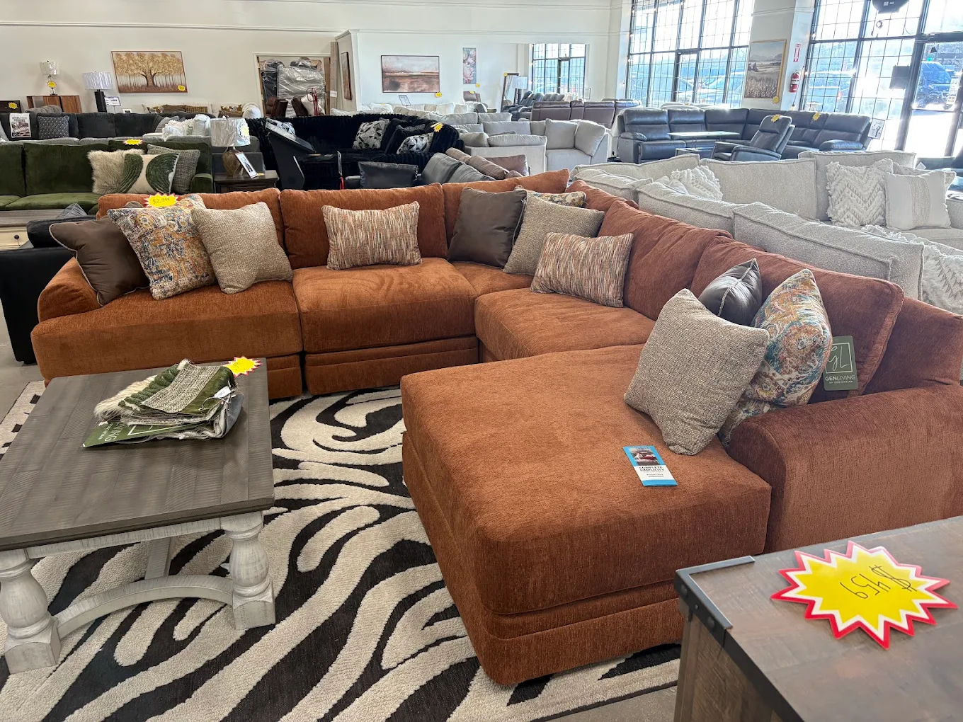 Rust-colored sectional sofa displayed in the Gateway Furniture showroom